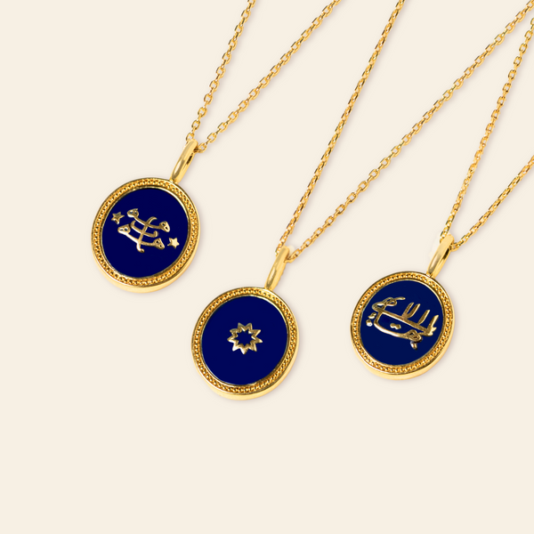 Three gold necklaces with round blue pendants, each featuring a different gold symbol: the greatest name, ringstone symbol and a nine-pointed star.